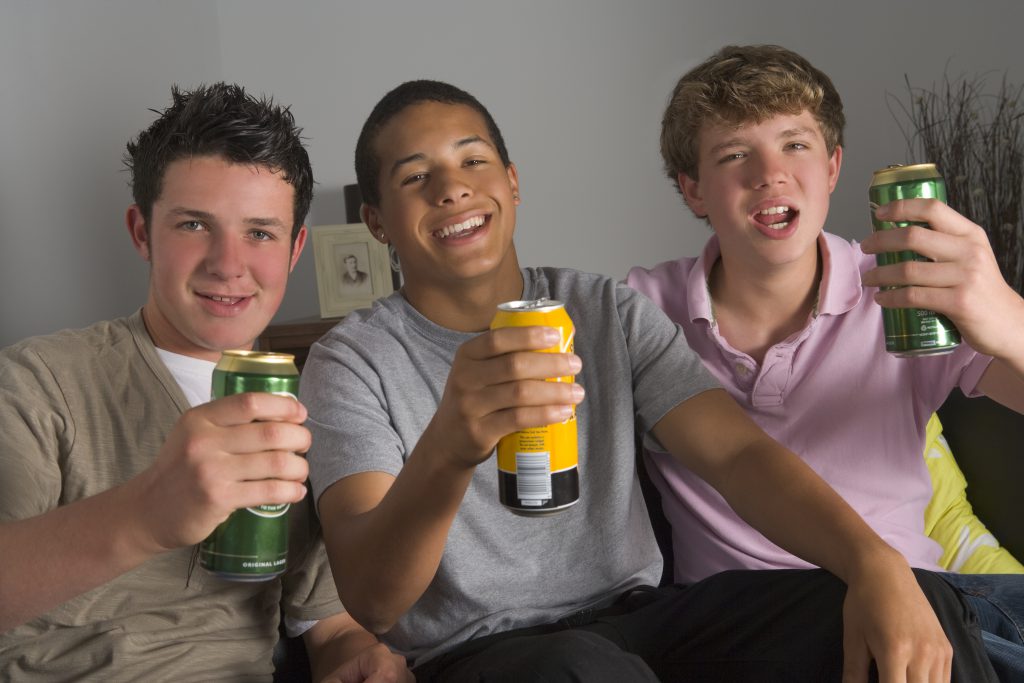 three underage boys with beer in their hands