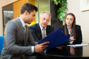Lawyer and Lawyer's Assistant Meeting With Client