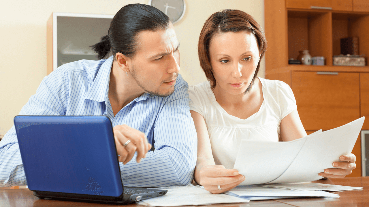 man and woman reviewing documents