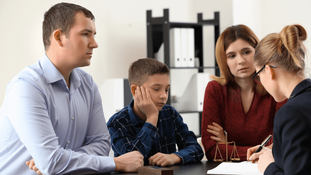 Couple with their child talking to a lawyer