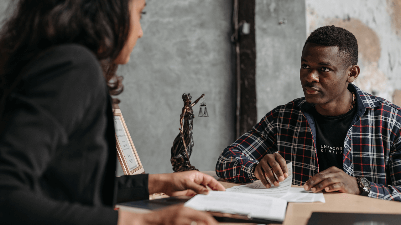 An attorney and a client discussing the case.