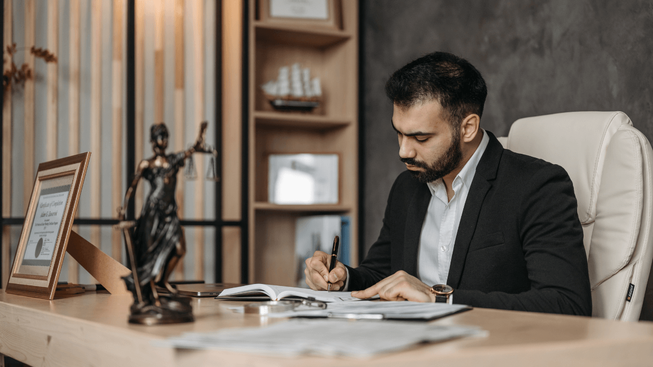 A lawyer signing documents.