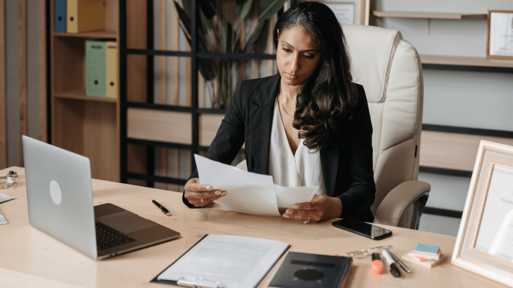 Attorney reading documents in her office.