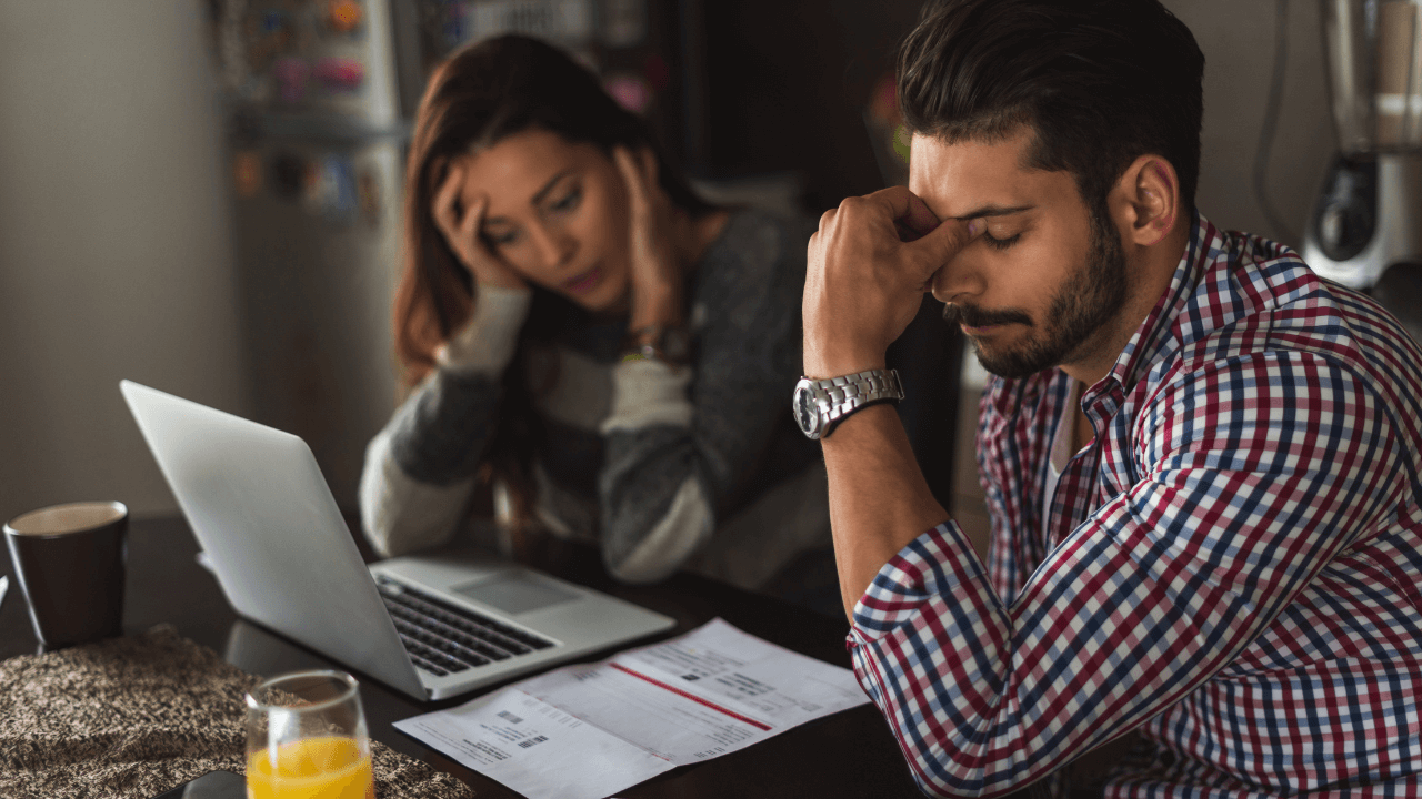 A couple going through their debt during divorce.