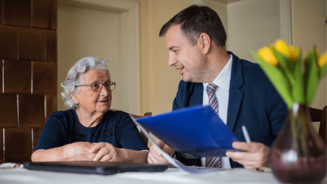 An attorney talking to a client about estate planning.