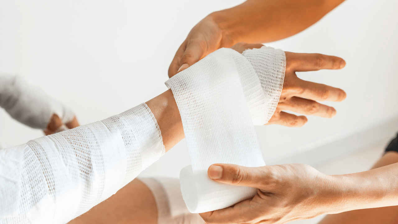 A person with burn injury getting bandaged.