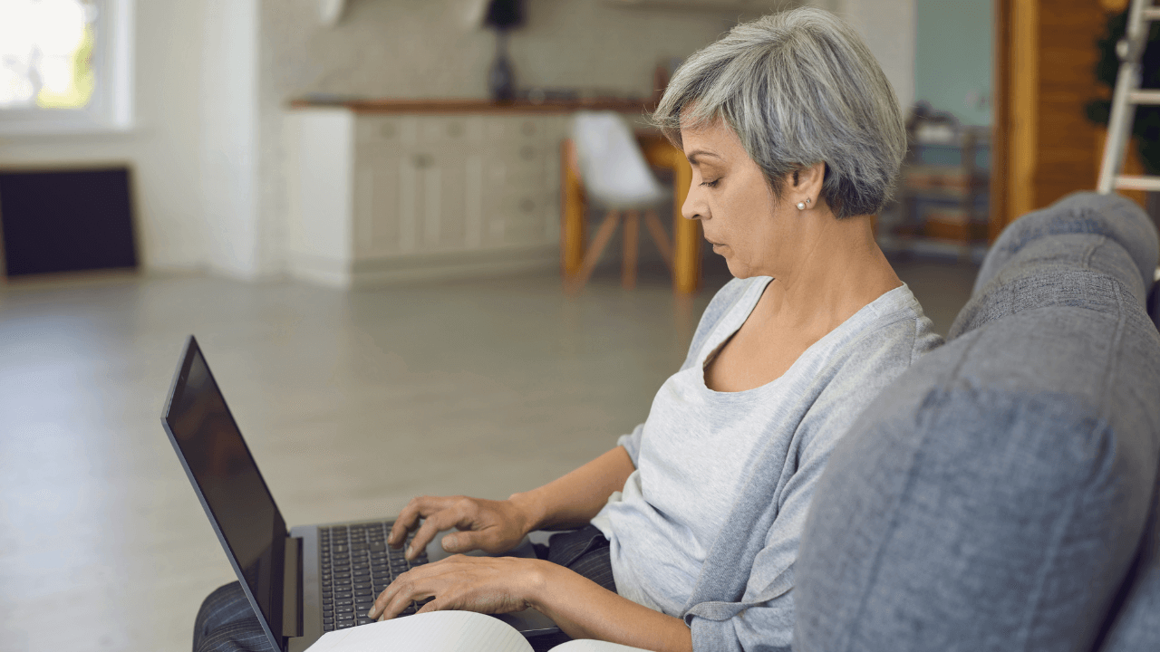 A photo of a woman creating a DIY will online.