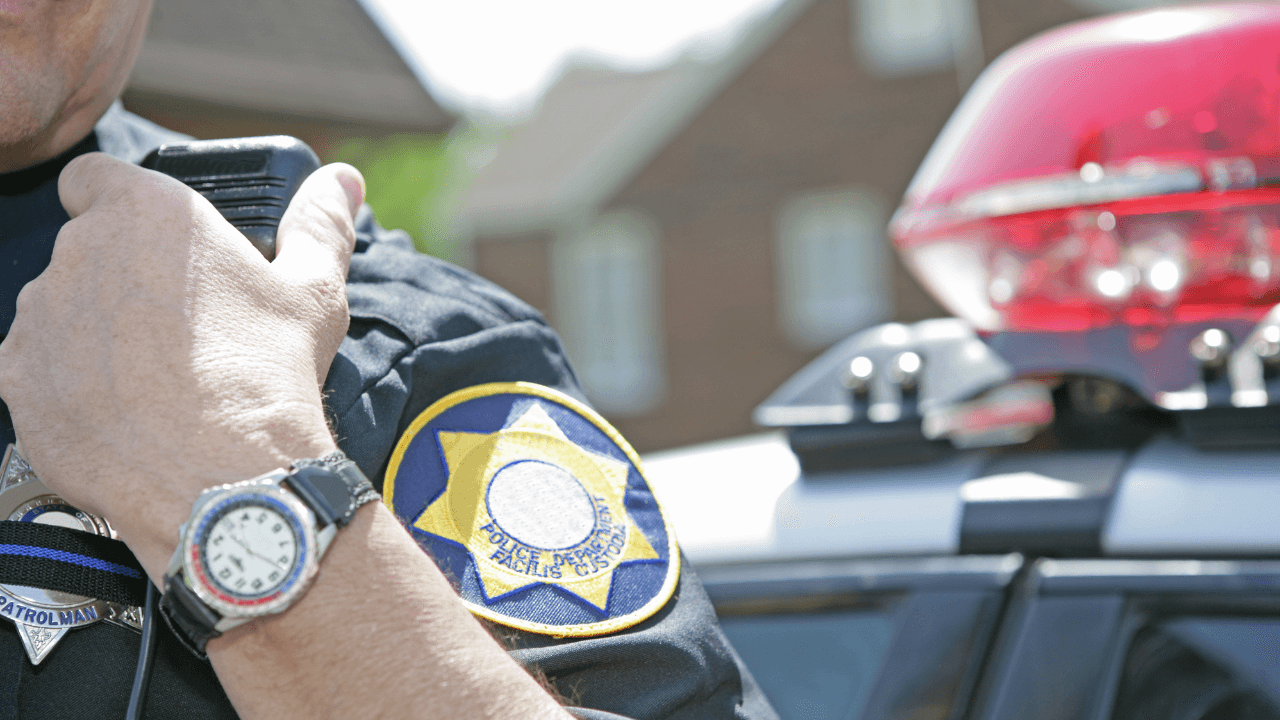A cop talking over his radio.